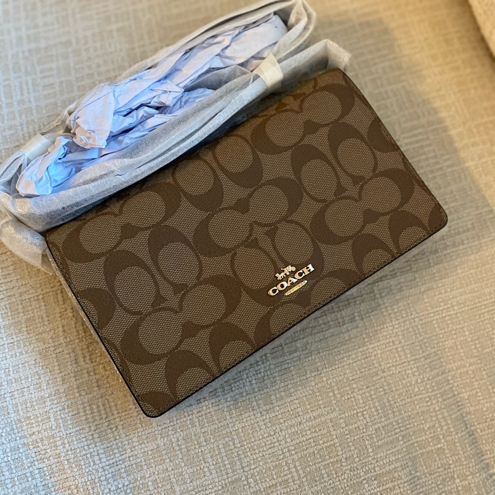 Crossbody Clutch In Signature Canvas.